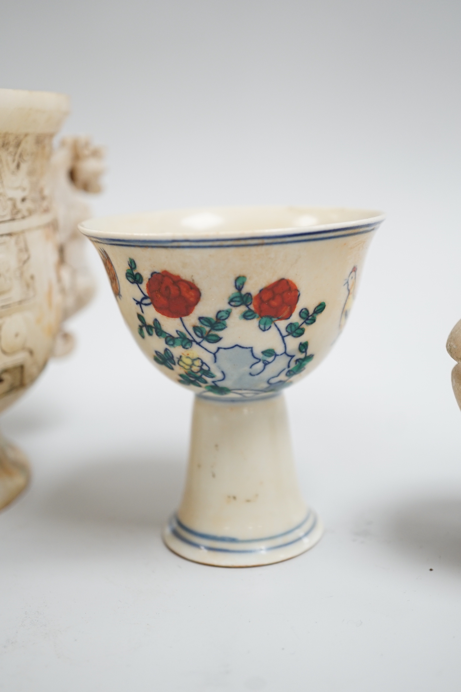 A Chinese burnt jade or hardstone censer, a stone cup and a doucai stem cup, censor 12cm high